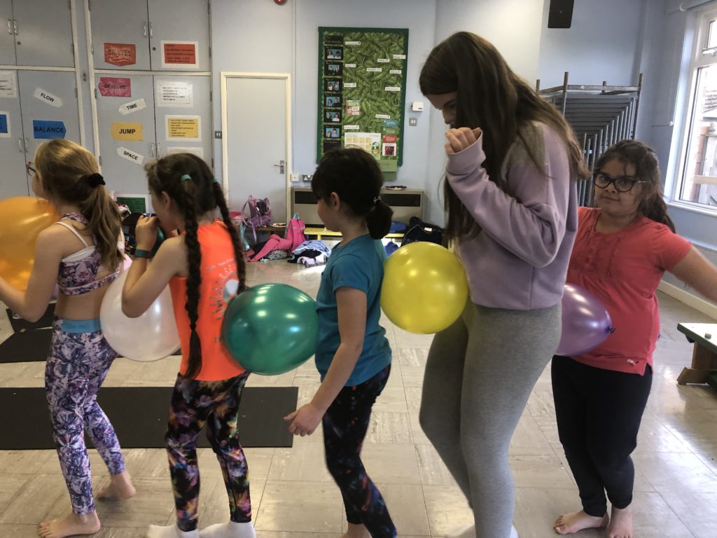 Children's yoga balloon game